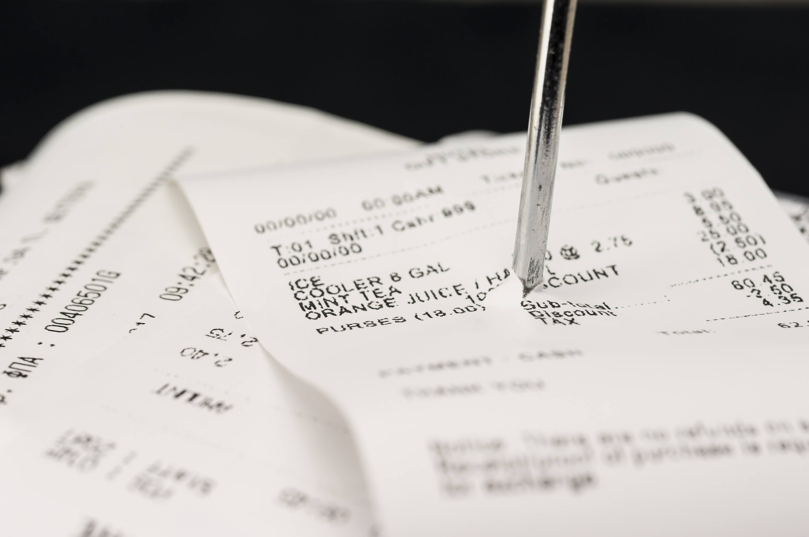 Close up shot of receipts piled up