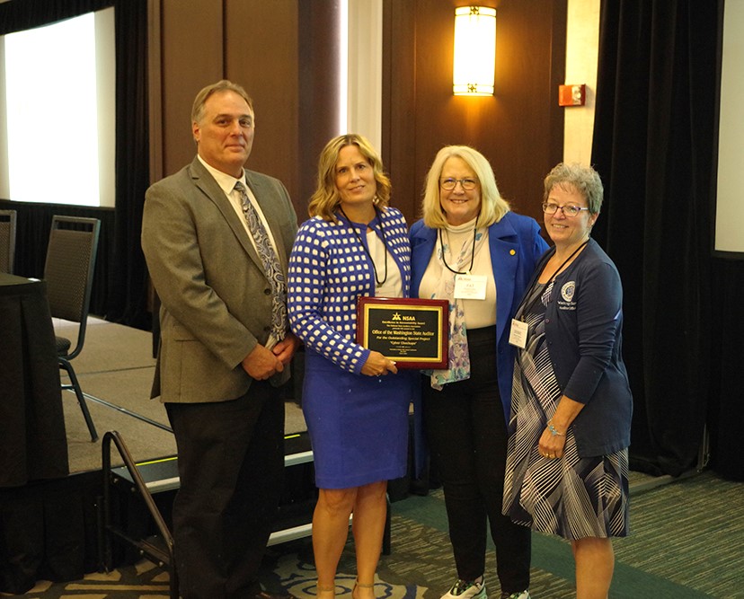 SAO's Daniel Mann, NSAA President April Renfro, State Auditor Pat McCarthy, and SAO's Debbie Pennick