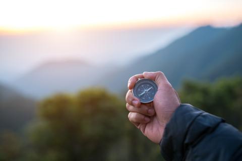 Male hand with compass